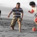 Jawa Timur, : Serunya bermain bola di pantai manikin