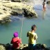 Sulawesi Tengah, : memancing ikan di pantai minajaya
