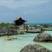 Maluku, : perpaduan pasir putih, laut biru dan batu karang di pantai tureloto